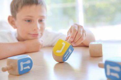 Why Does a Dreidel Spin? The Science Behind the Chanukah Game
