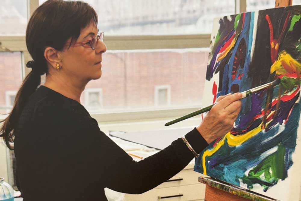 Tamar painting, continuing to create with hope and strength