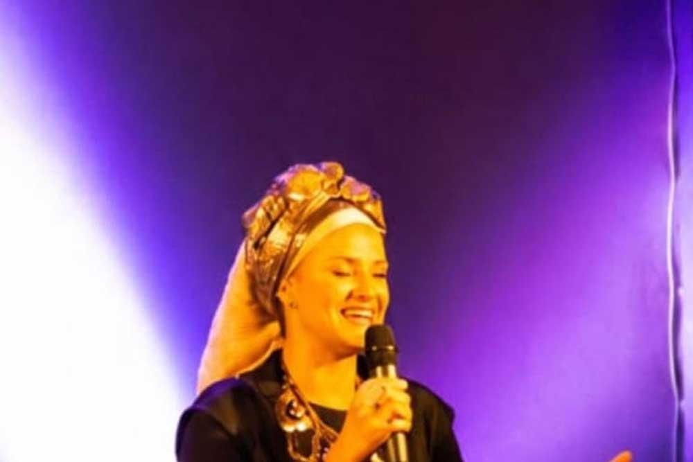 Meital singing at a performance