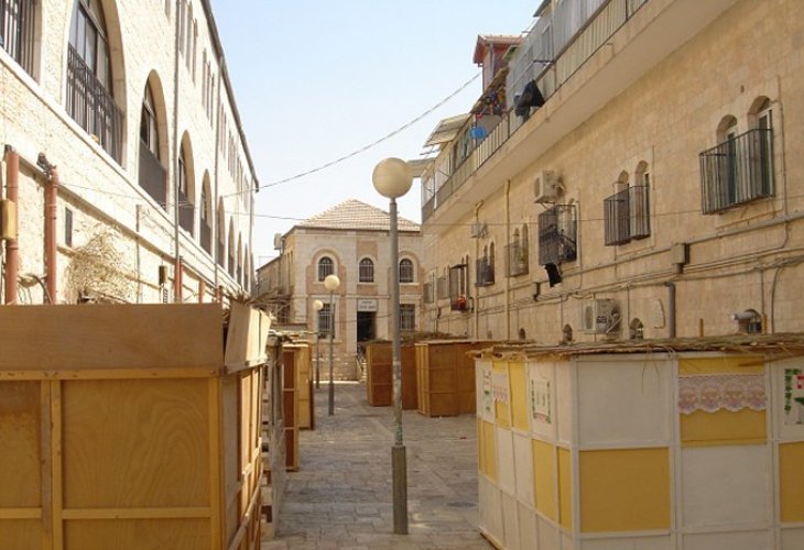 Sukkot lining a street in Jerusalem during the festival. Photo: Flash90