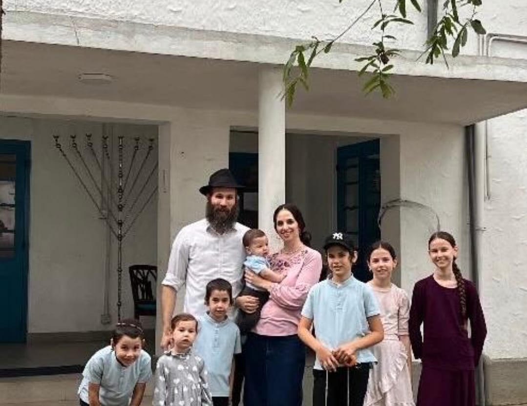 Mushka with her family visiting the Chabad house