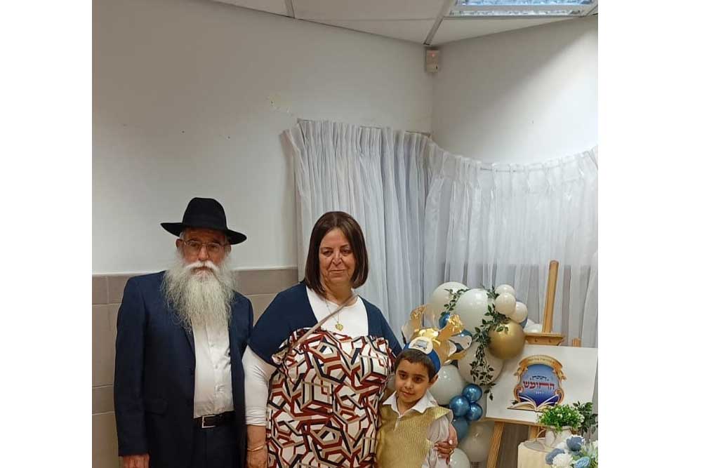 Miriam and her husband with one of their grandchildren