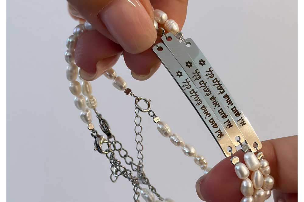 A bracelet created by Muriel, engraved with “There is no despair in the world at all.”